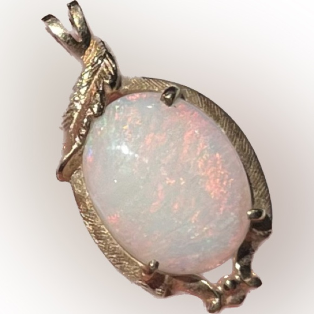 14K SOLID GOLD oval OPAL pendant with textured leaf motif.